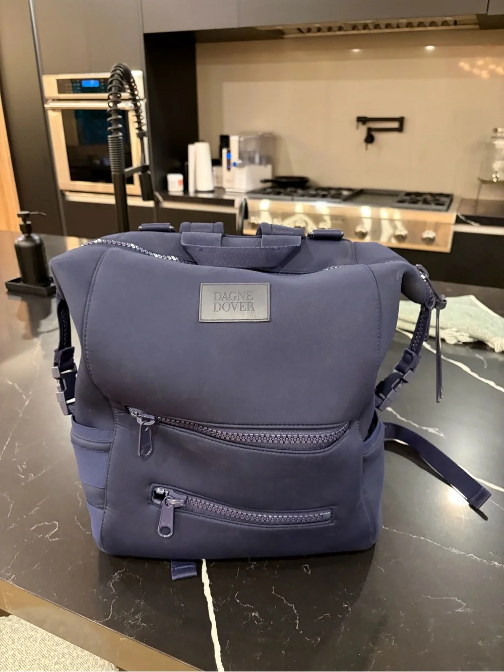 Dagne Dover Navy Neoprene Backpack with Front Zip Pockets